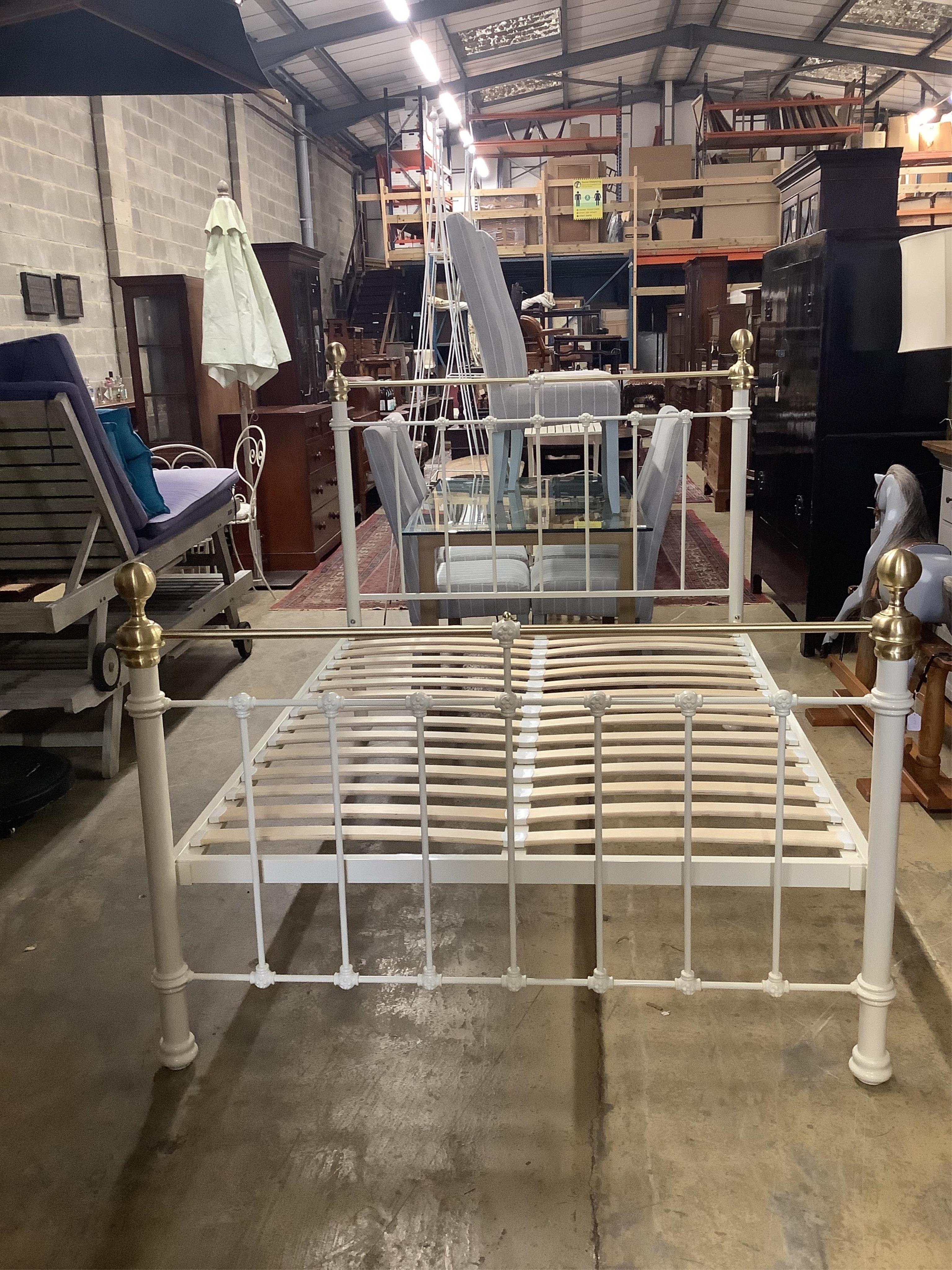 A modern Victorian style brass mounted double bedframe, width 140cm, length 200cm, height 140cm. Condition - good